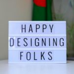 A sign that says happy designing folk