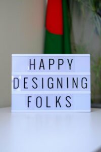 A sign that says happy designing folk